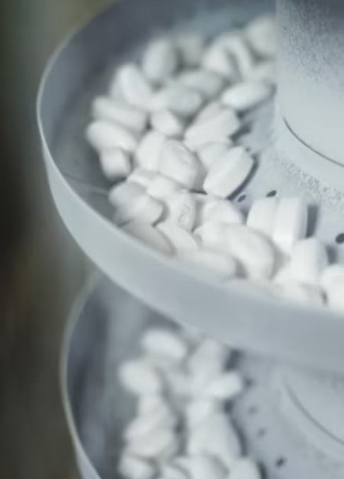 Black and white photo of pharmaceutical pills — contrast with whole-food grass-fed beef organ nutrition